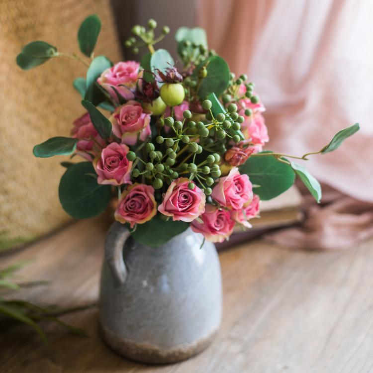 A beautiful 12-inch tall artificial silk flower bouquet featuring pink roses and lush greenery, perfect for home decor.