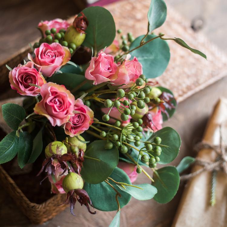 A beautiful 12-inch tall artificial silk flower bouquet featuring pink roses and lush greenery, perfect for home decor.