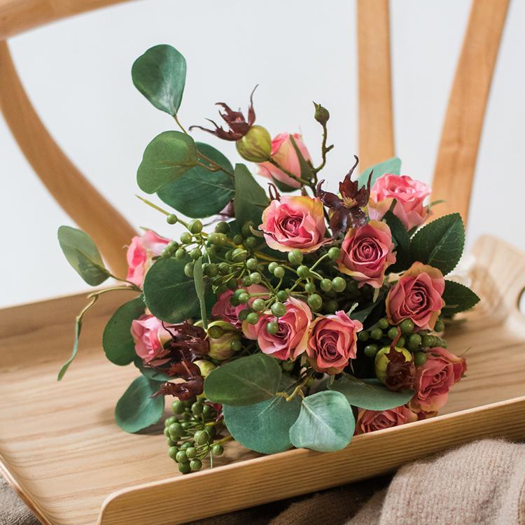 A beautiful 12-inch tall artificial silk flower bouquet featuring pink roses and lush greenery, perfect for home decor.