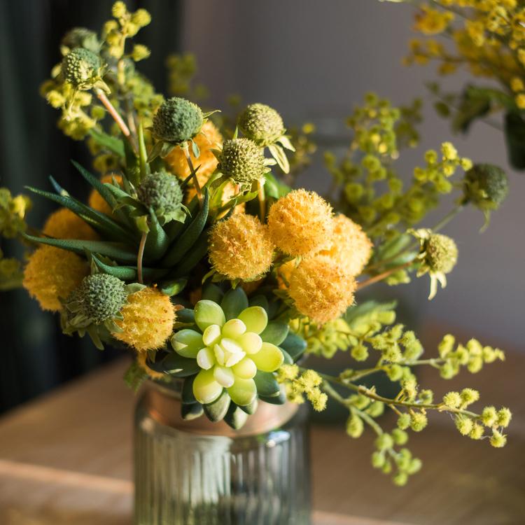 A vibrant 13-inch tall artificial silk flower bouquet featuring yellow dahlias and lush green leaves, perfect for spring decor.