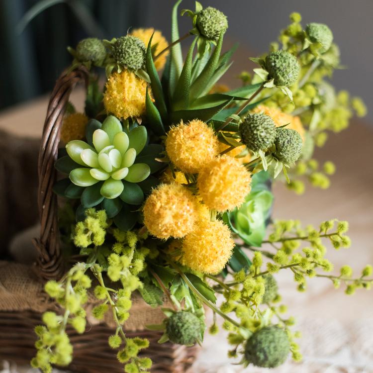 A vibrant 13-inch tall artificial silk flower bouquet featuring yellow dahlias and lush green leaves, perfect for spring decor.