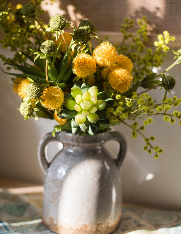 A vibrant 13-inch tall artificial silk flower bouquet featuring yellow dahlias and lush green leaves, perfect for spring decor.