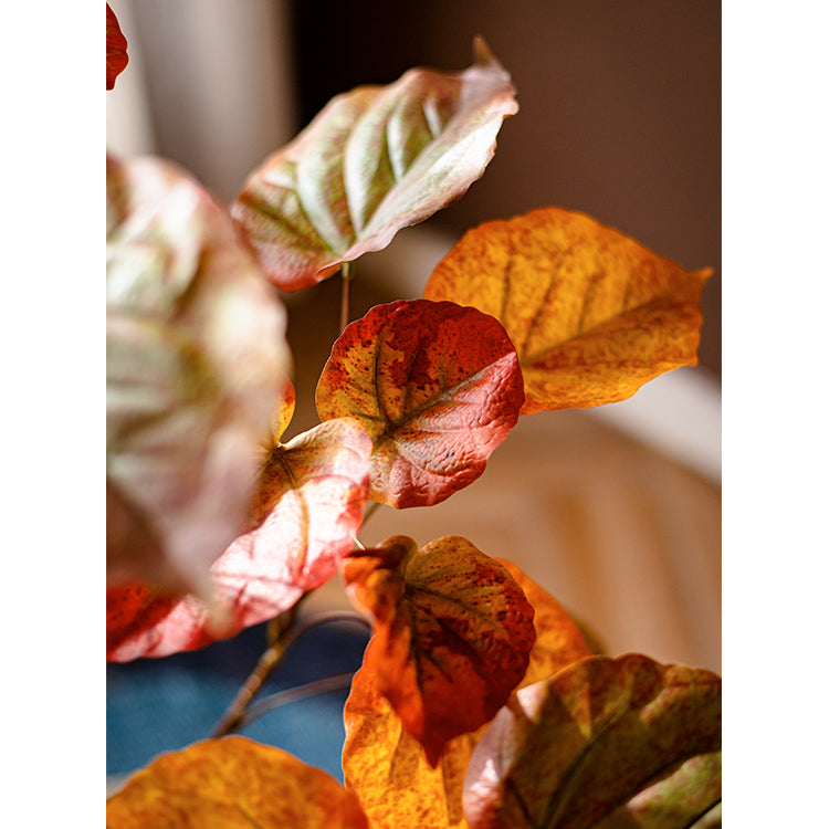 Artificial Silk Red Leaf Banyan Tree in a black pot, showcasing vibrant red leaves and a realistic design, perfect for indoor decoration.