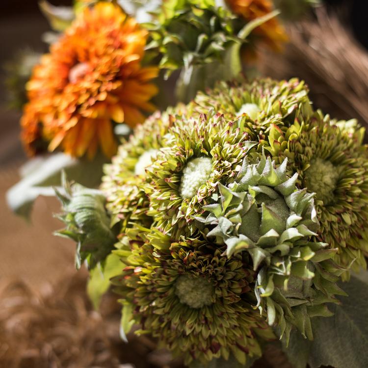 A vibrant artificial sunflower bouquet featuring five flower stems and three bud stems in green and orange colors, standing 18 inches tall.