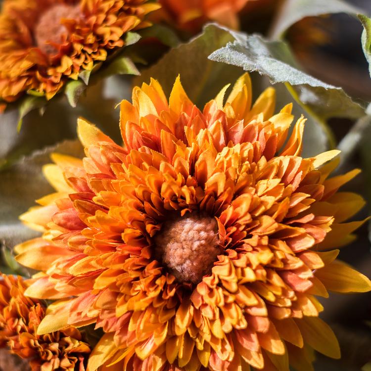 A vibrant artificial sunflower bouquet featuring five flower stems and three bud stems in green and orange colors, standing 18 inches tall.