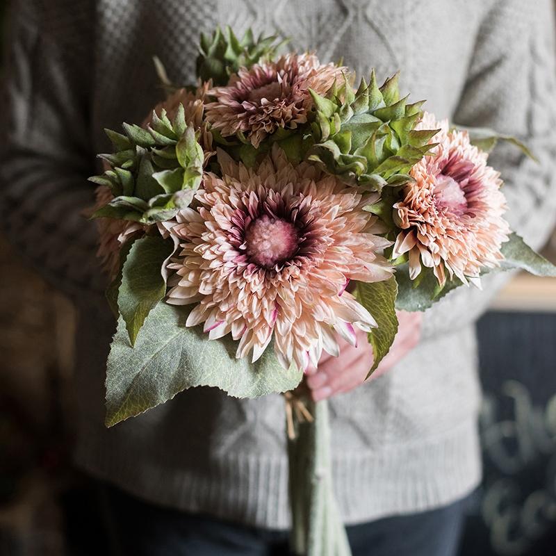 A vibrant 18-inch tall artificial sunflower bouquet in pink, featuring five flower stems and three bud stems, showcasing realistic details and colors.