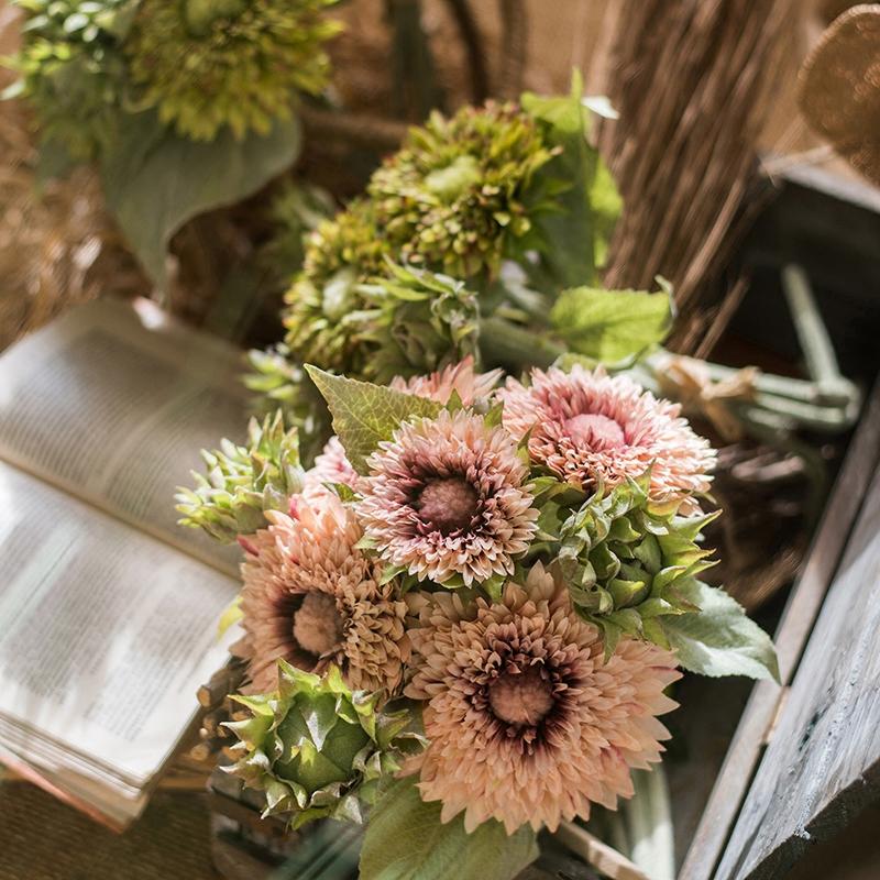 A vibrant 18-inch tall artificial sunflower bouquet in pink, featuring five flower stems and three bud stems, showcasing realistic details and colors.