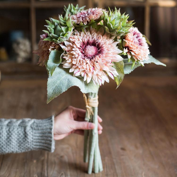 A vibrant 18-inch tall artificial sunflower bouquet in pink, featuring five flower stems and three bud stems, showcasing realistic details and colors.