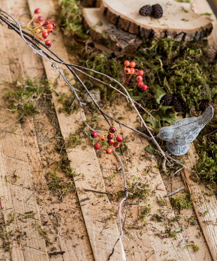 A 39-inch long artificial vine featuring vibrant orange faux berries and brown accents, perfect for home decor.