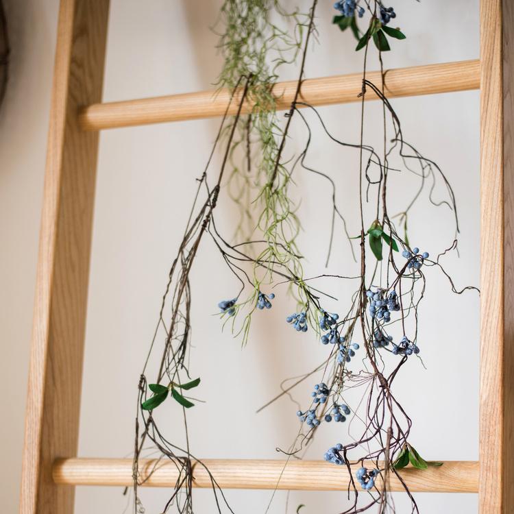 Artificial Wild Blueberry Hanging Vine, 43 inches long, featuring vibrant blue berries and lush green leaves, perfect for home decor.