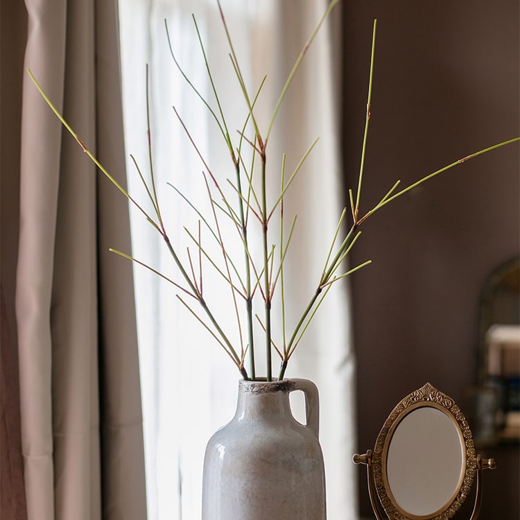 30-inch tall artificial bamboo stem with realistic green leaves, perfect for home or office decor.