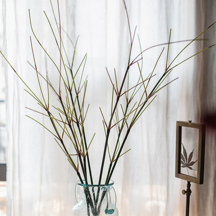 30-inch tall artificial bamboo stem with realistic green leaves, perfect for home or office decor.