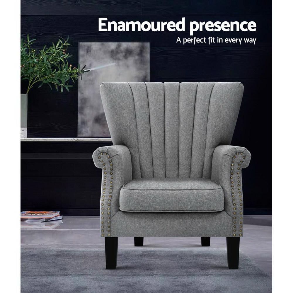 Artiss Upholstered Fabric Armchair in grey with waterfall design and button studs, featuring rubber wood legs and anti-scratch feet pads.