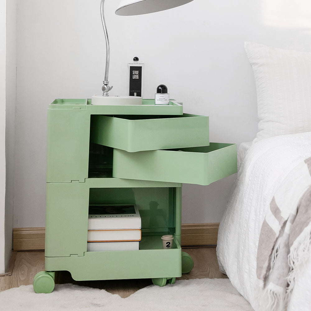 ArtissIn Green 3-Tier Bedside Table Storage Trolley with fold-out shelves and wheels, showcasing its stylish design and practical storage features.