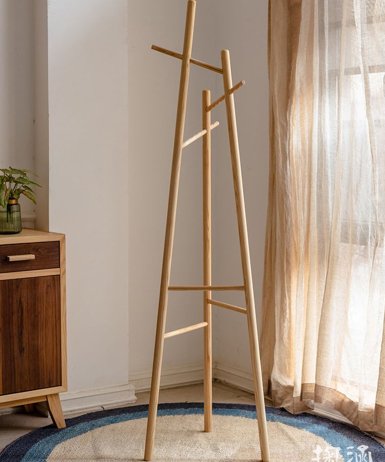 Elegant Ash Wood Coat Rack standing tall, showcasing natural wood grain and design, perfect for entryways.