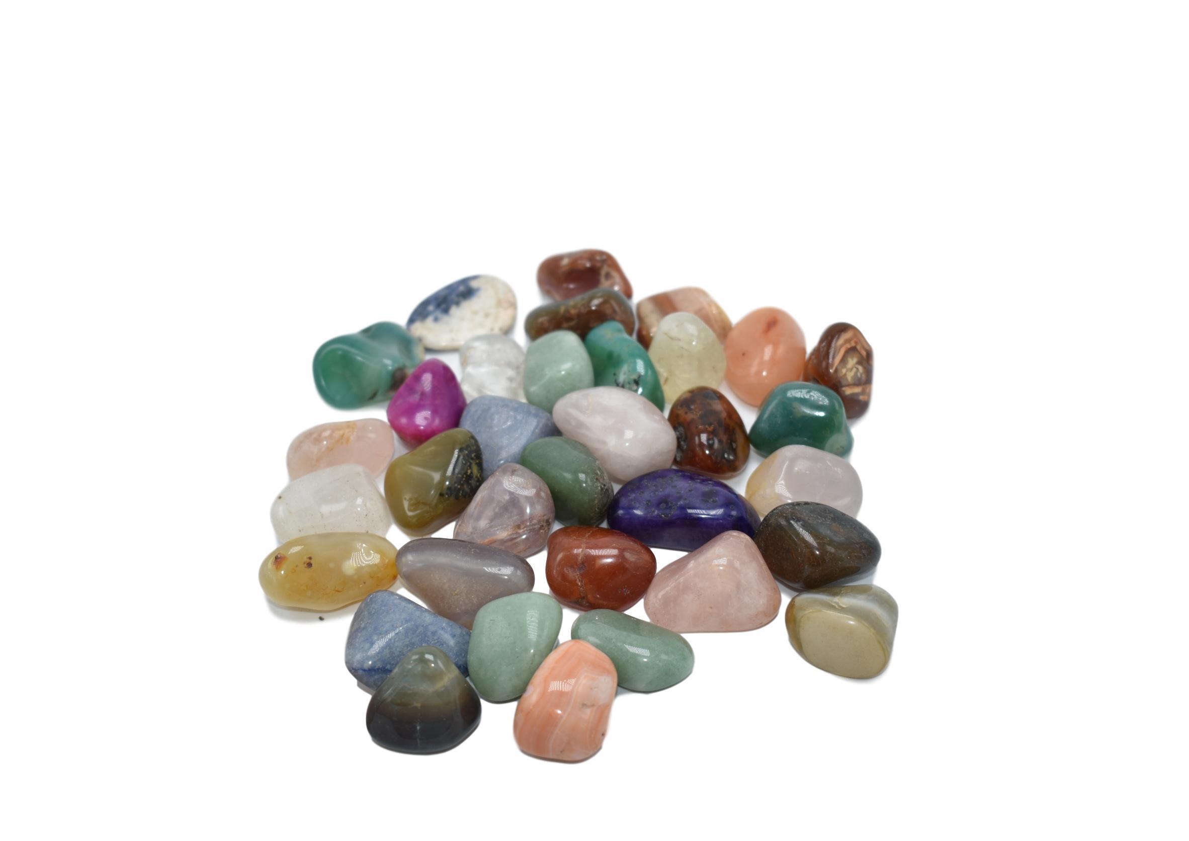 A collection of assorted tumbled stones in various colors and patterns, showcasing their polished surfaces and natural beauty.