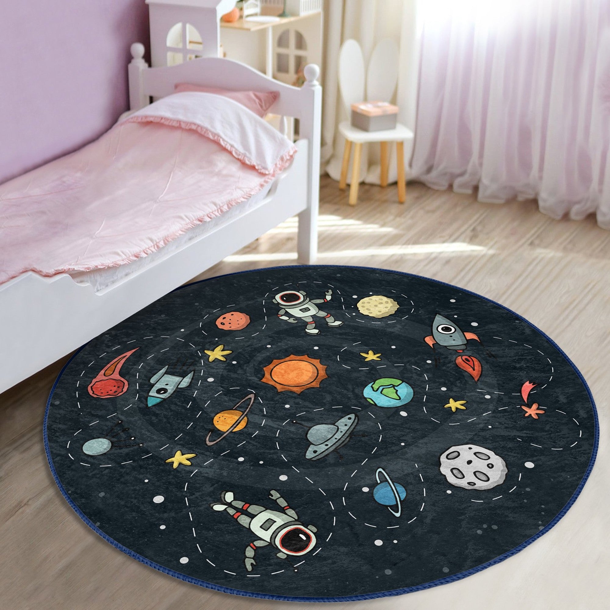 A colorful round rug featuring playful astronauts and space rockets, designed for kids' rooms, showcasing a soft velvet texture.