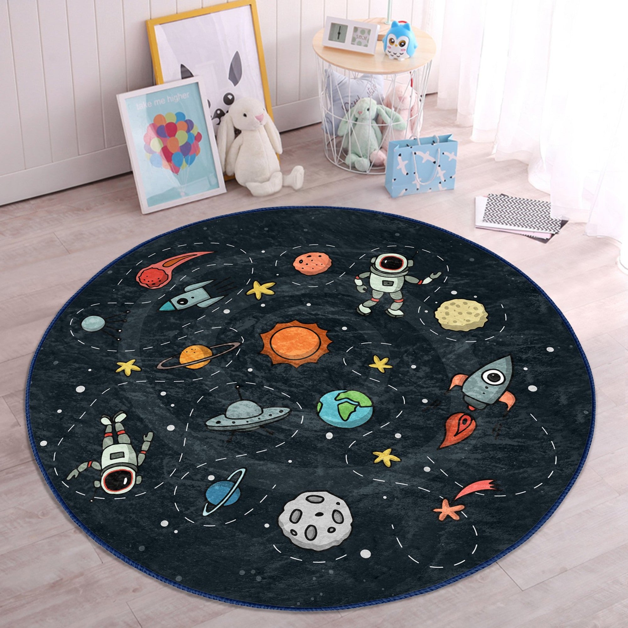 A colorful round rug featuring playful astronauts and space rockets, designed for kids' rooms, showcasing a soft velvet texture.