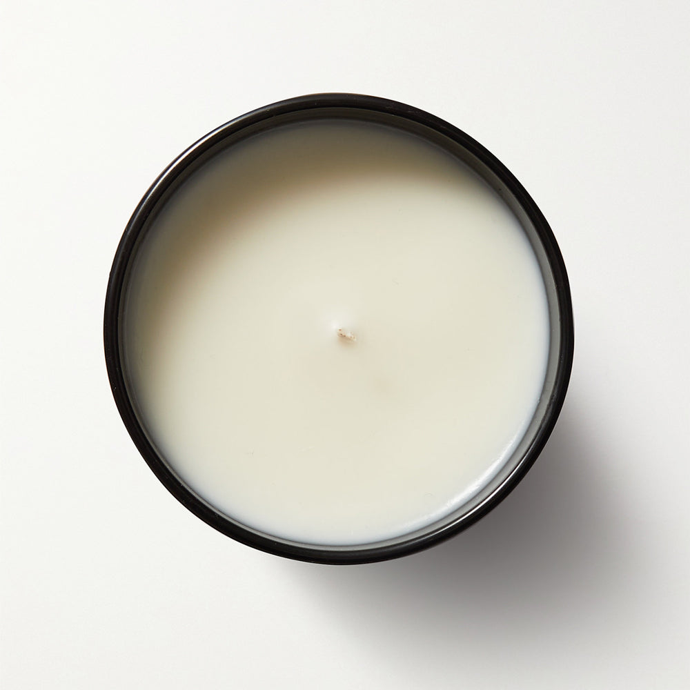 Aurora Christmas Pudding Scented Soy Candle in a matte black jar, showcasing its elegant design and festive appeal.