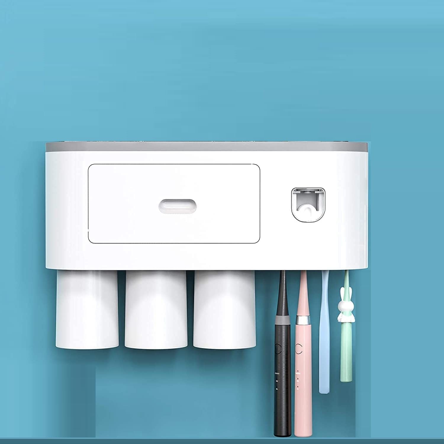 Automatic wall mounted toothbrush holder with magnetic cups in white and gray, designed for kids and families, featuring a toothpaste dispenser and storage tray.