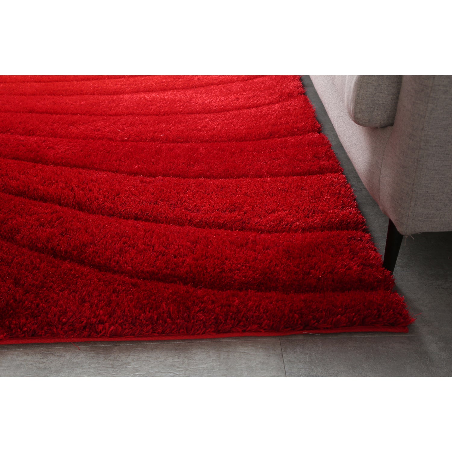 Ava 3D Red Shag Rug featuring a modern wave design, plush texture, and vibrant red color, perfect for enhancing home decor.