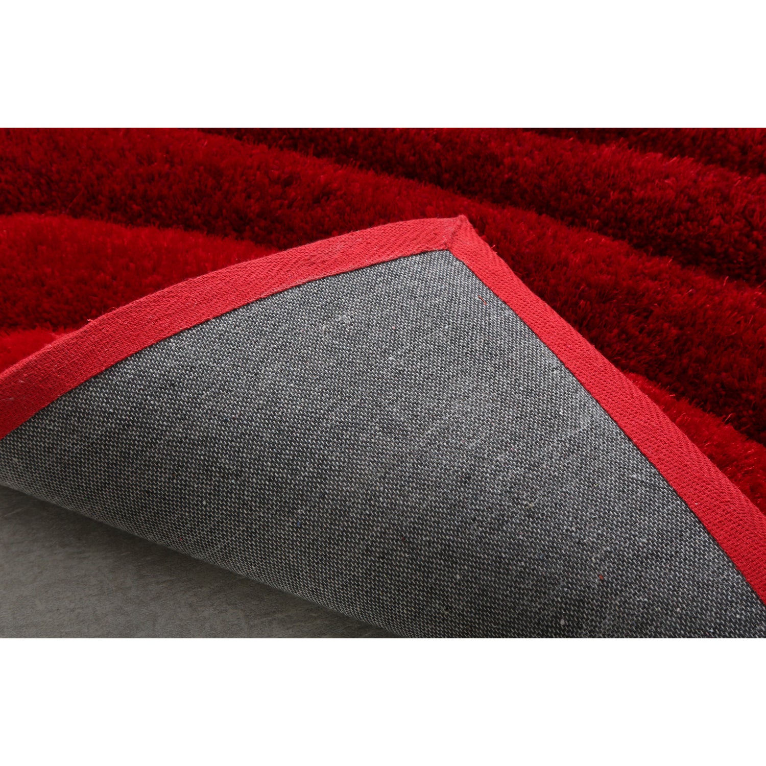 Ava 3D Red Shag Rug featuring a modern wave design, plush texture, and vibrant red color, perfect for enhancing home decor.