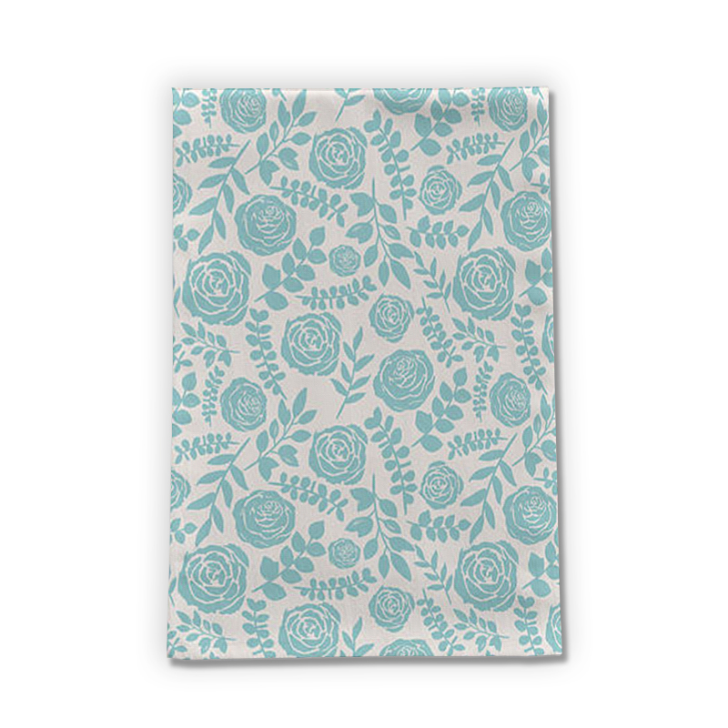 A soft cotton twill tea towel featuring a charming baby blue floral design, perfect for kitchen use and decor.