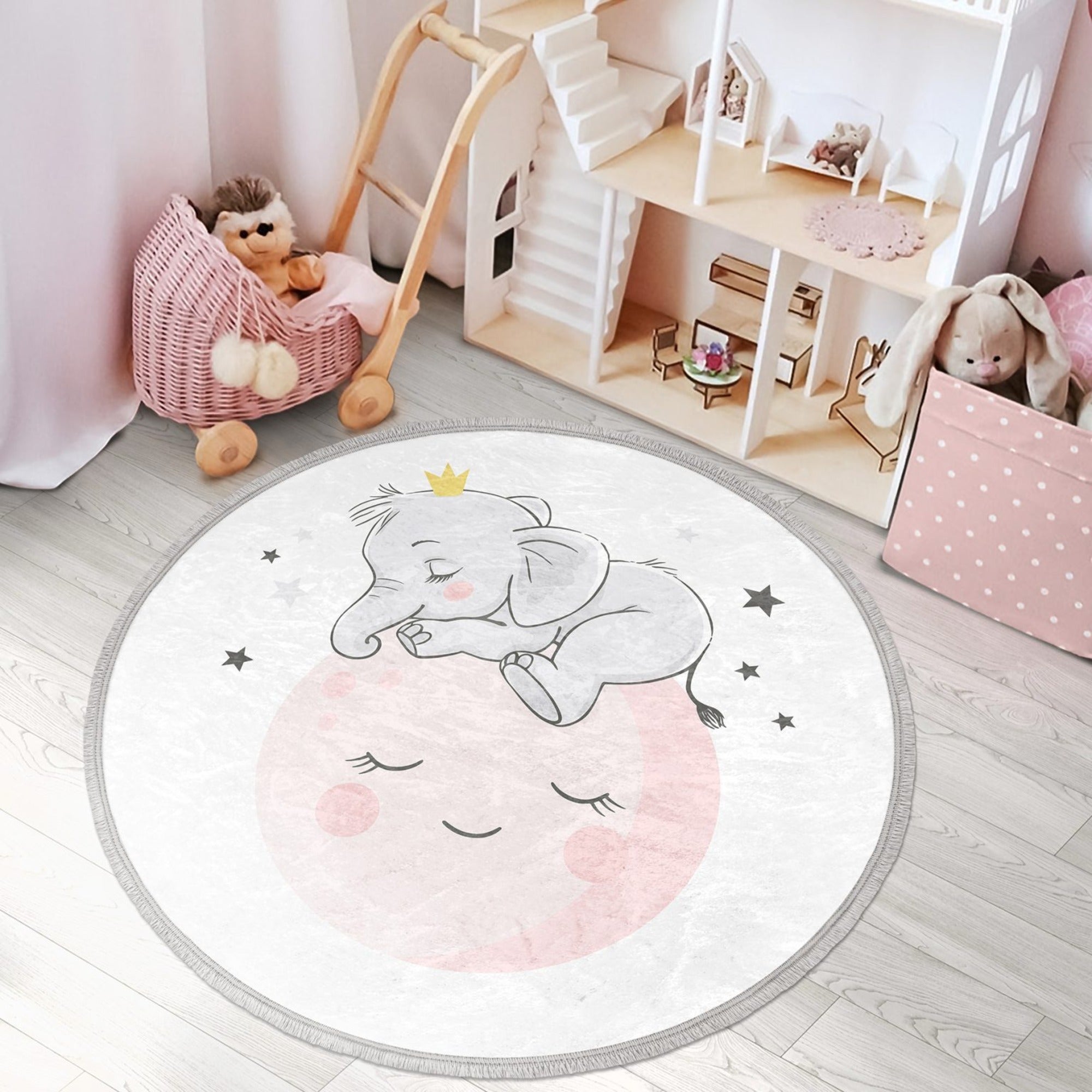 Round rug featuring a baby elephant and moon print, designed for kids' rooms, made of shiny velvet fabric with fringes.