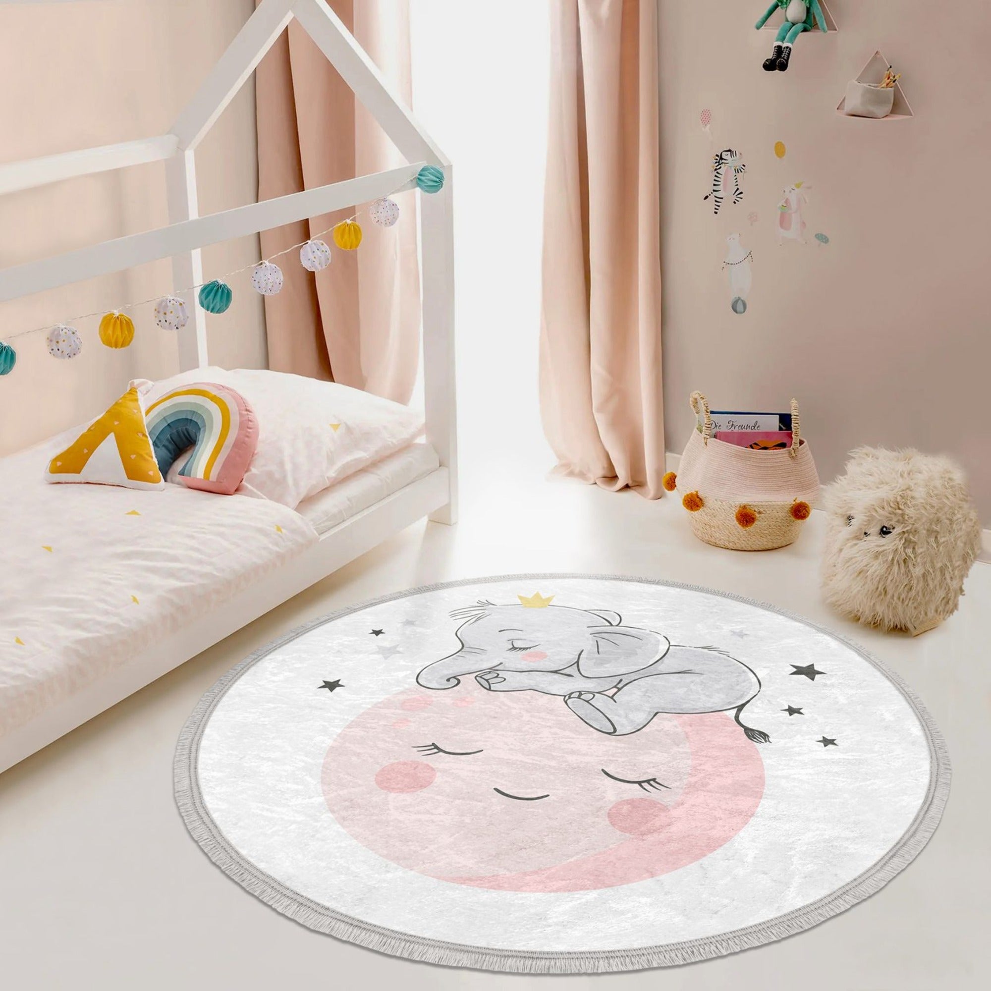 Round rug featuring a baby elephant and moon print, designed for kids' rooms, made of shiny velvet fabric with fringes.