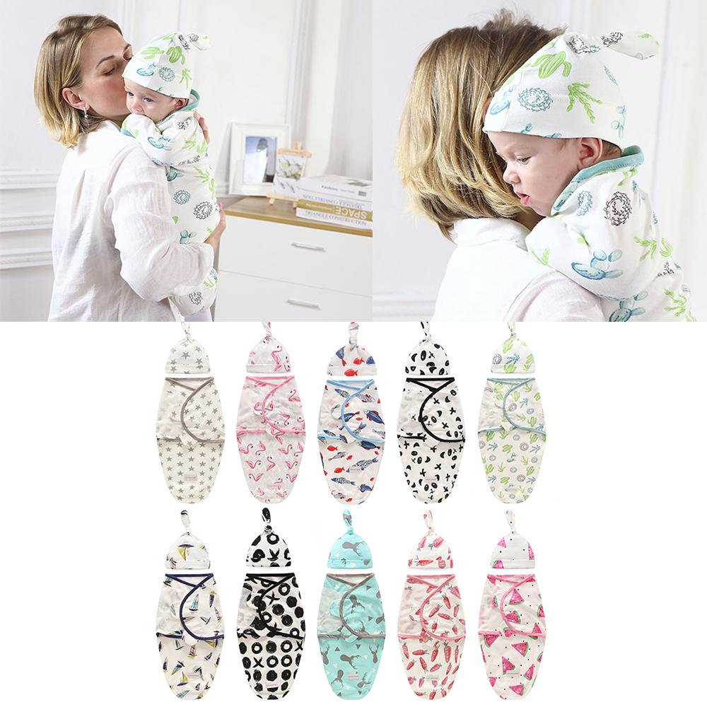 Baby swaddle blanket and cap set in cartoon design, made from 100% cotton, suitable for newborns.