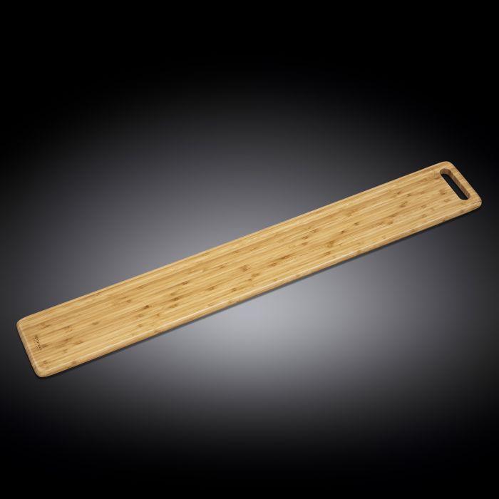 A long rectangular bamboo charcuterie board with a cut-out handle, showcasing its natural texture and elegant design, perfect for serving appetizers.