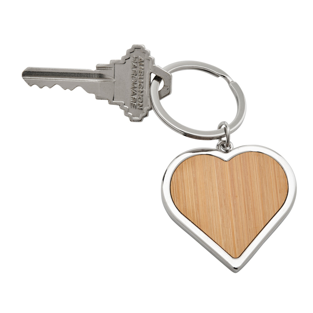 Bamboo Heart Keychain with intricate metal trim, showcasing its handcrafted design and heart shape.