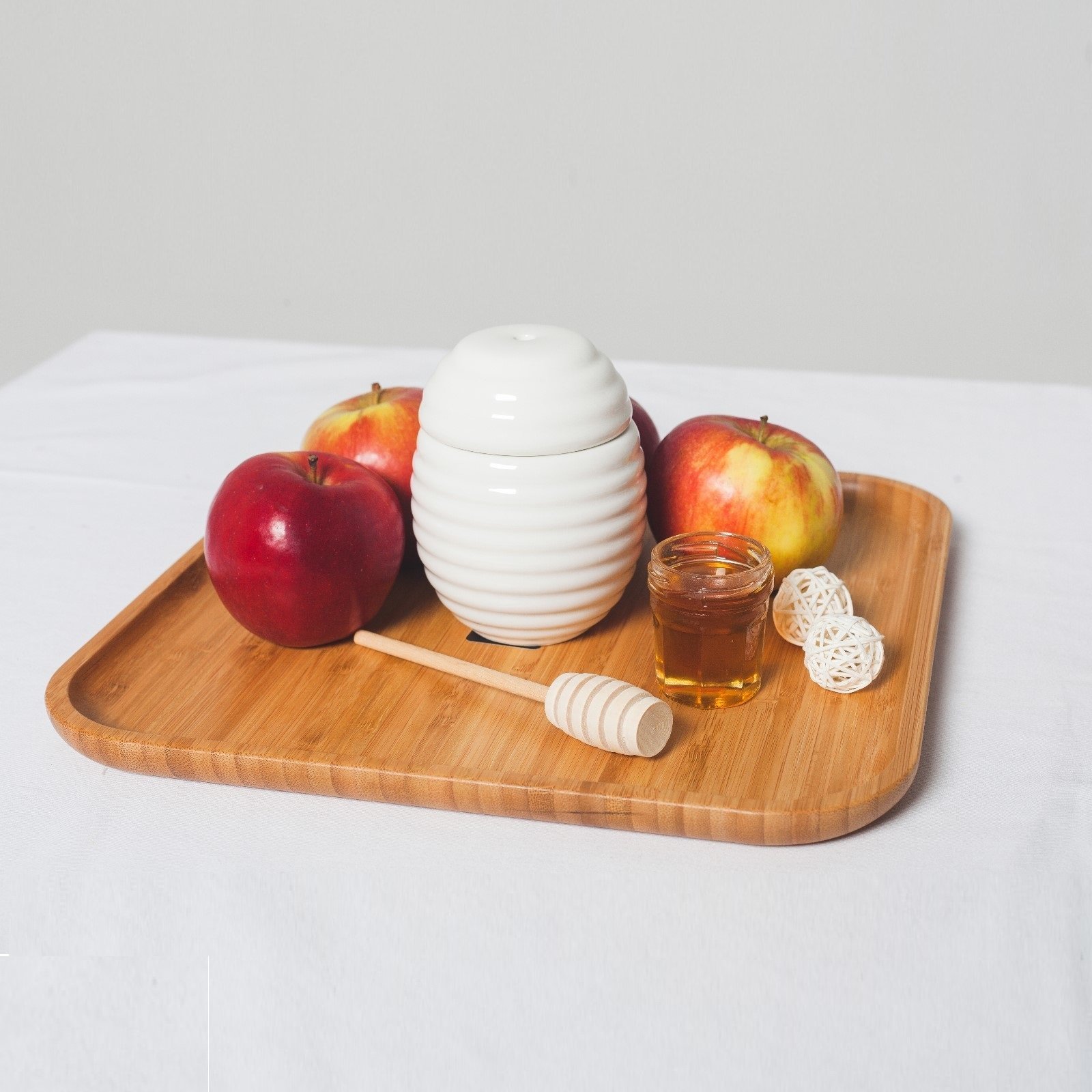 A 14-inch square bamboo platter, elegantly designed for serving appetizers and barbecue dishes, showcasing its natural texture and eco-friendly material.