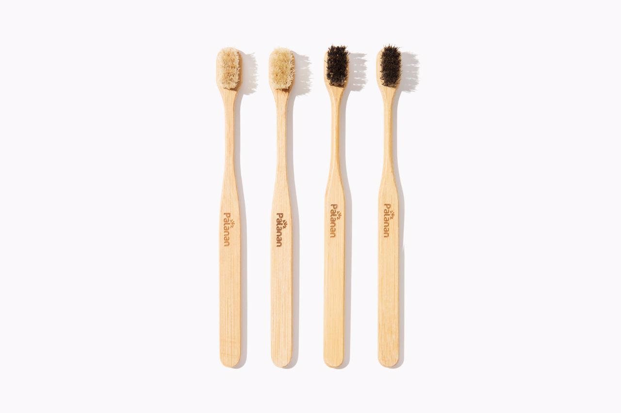 Bamboo Toothbrush Bundle - Mix featuring 2 white and 2 dark bamboo toothbrushes, eco-friendly and sustainable oral care solution.