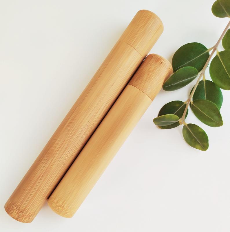 A sustainable bamboo toothbrush case, lightweight and eco-friendly, designed to hold a bamboo toothbrush securely.