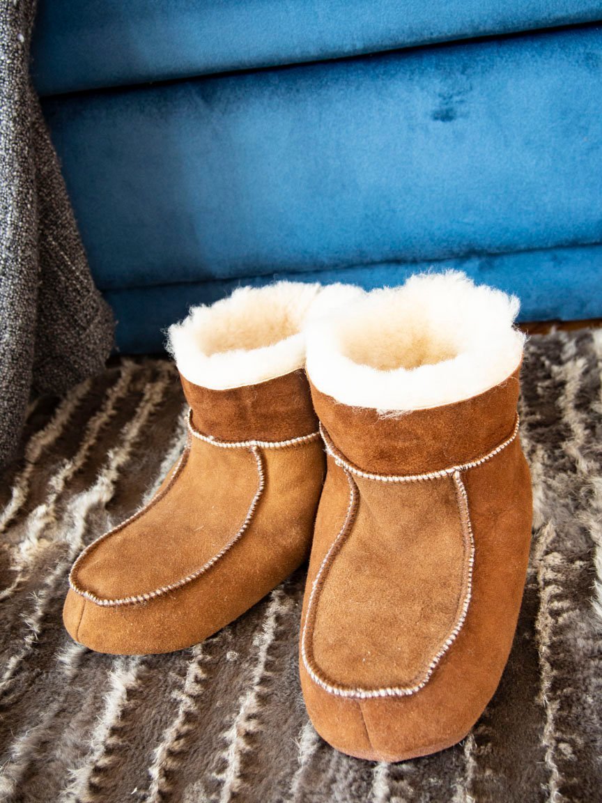 Bambosze Sheepskin Slippers made from natural sheepskin and leather, showcasing their elegant design and plush texture.