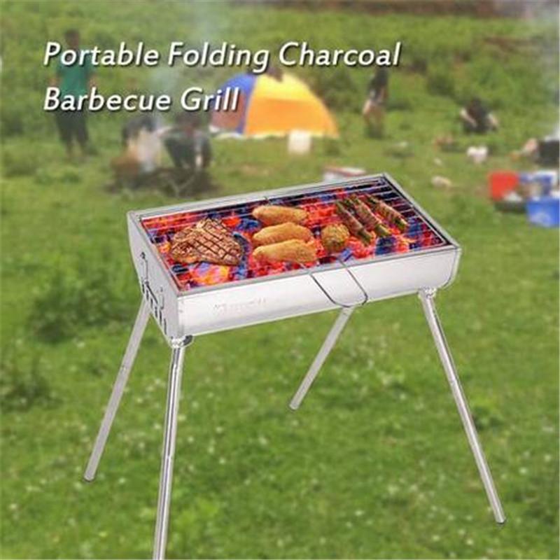 Portable folding charcoal barbecue grill made of stainless steel, ideal for outdoor cooking.