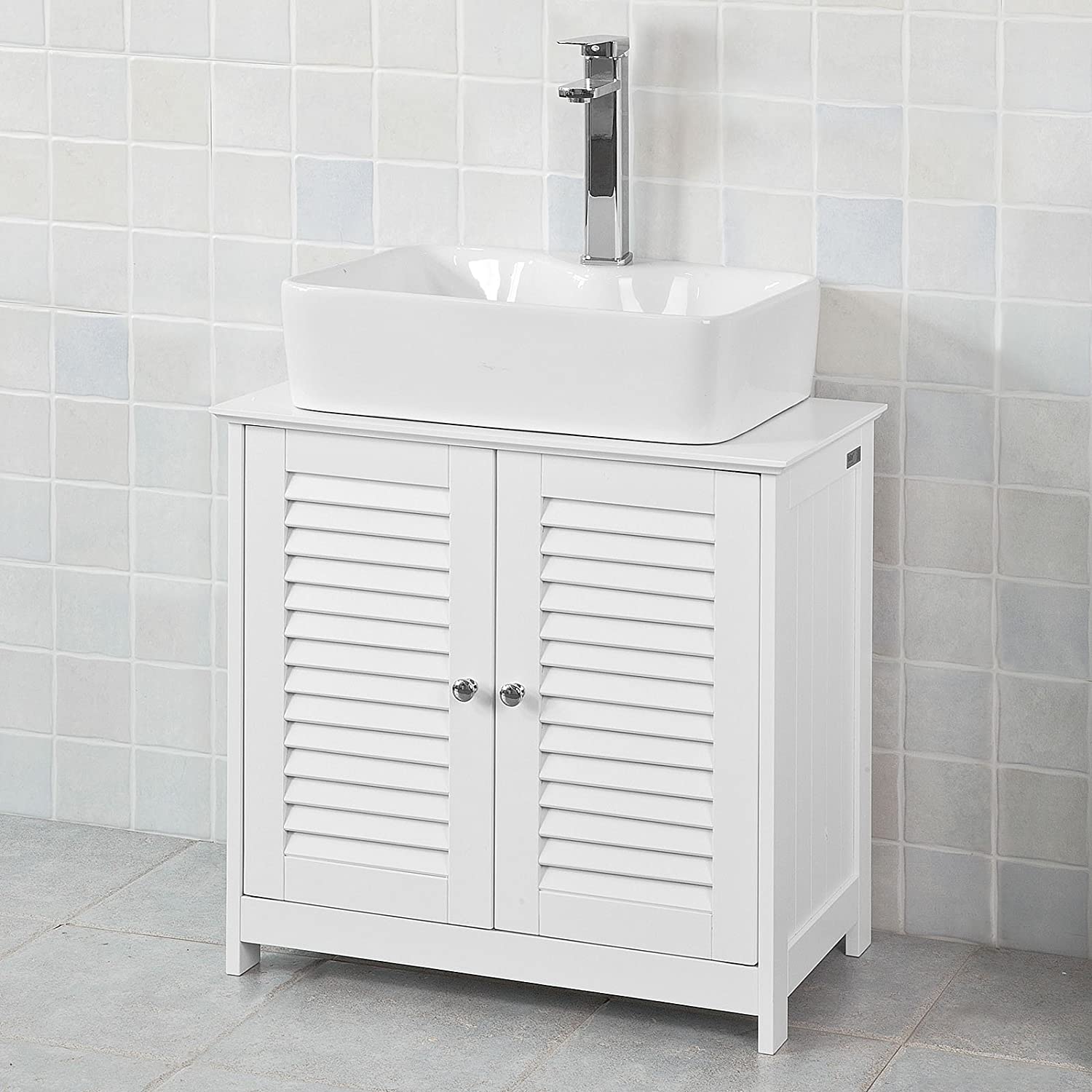 Stylish white bathroom cabinet with chromed handles and shutter doors, designed for practical storage.