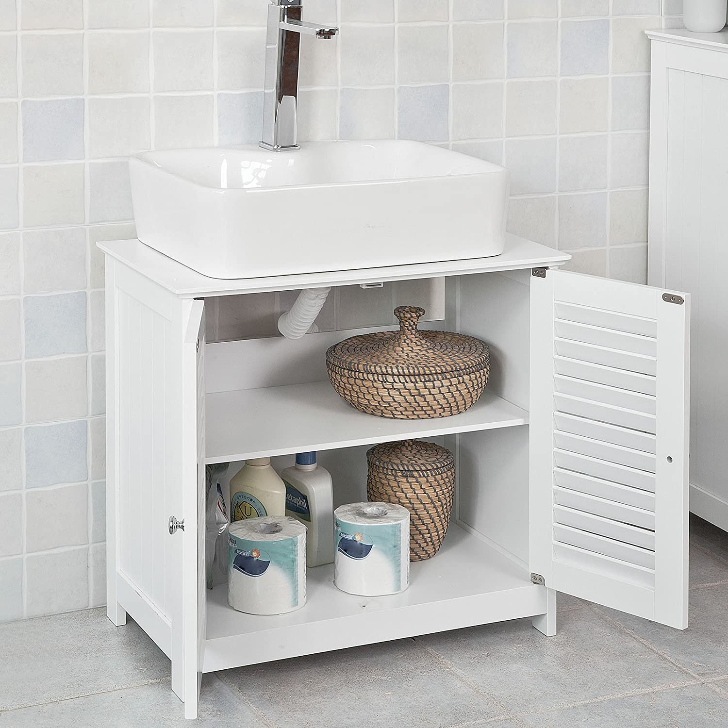 Stylish white bathroom cabinet with chromed handles and shutter doors, designed for practical storage.