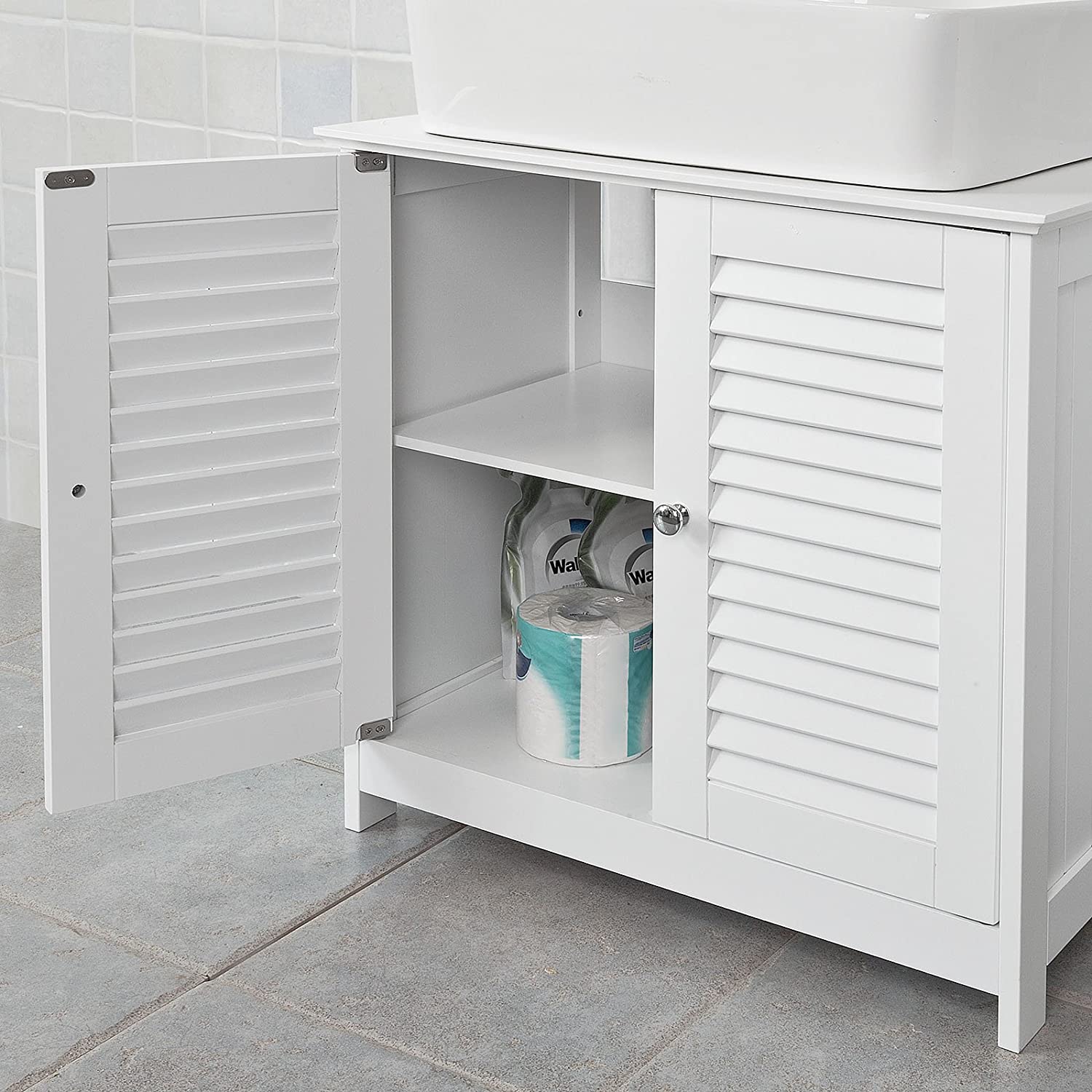 Stylish white bathroom cabinet with chromed handles and shutter doors, designed for practical storage.