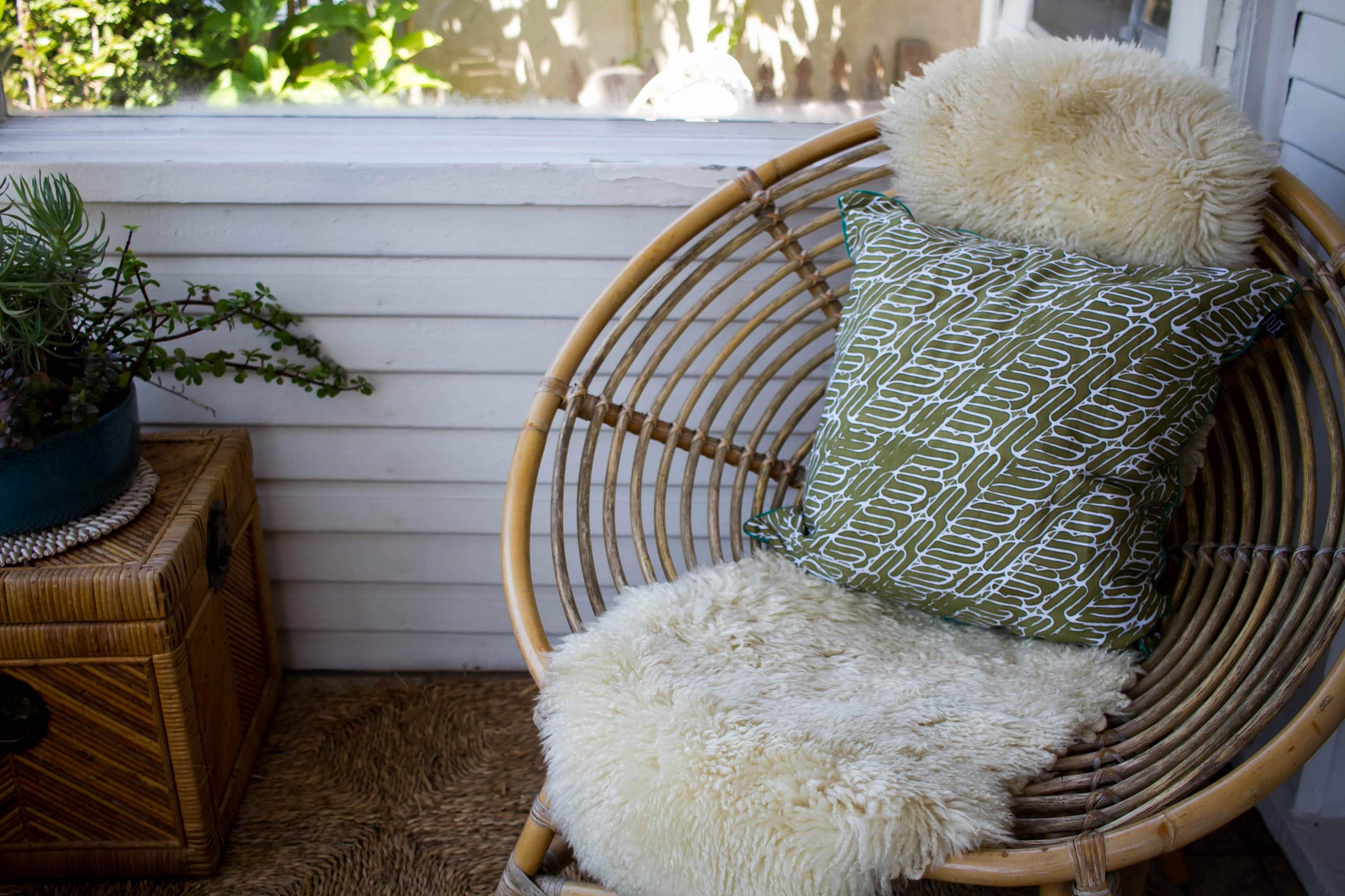 Olive green batik pillow with intricate traditional designs, handwoven and perfect for home decor.