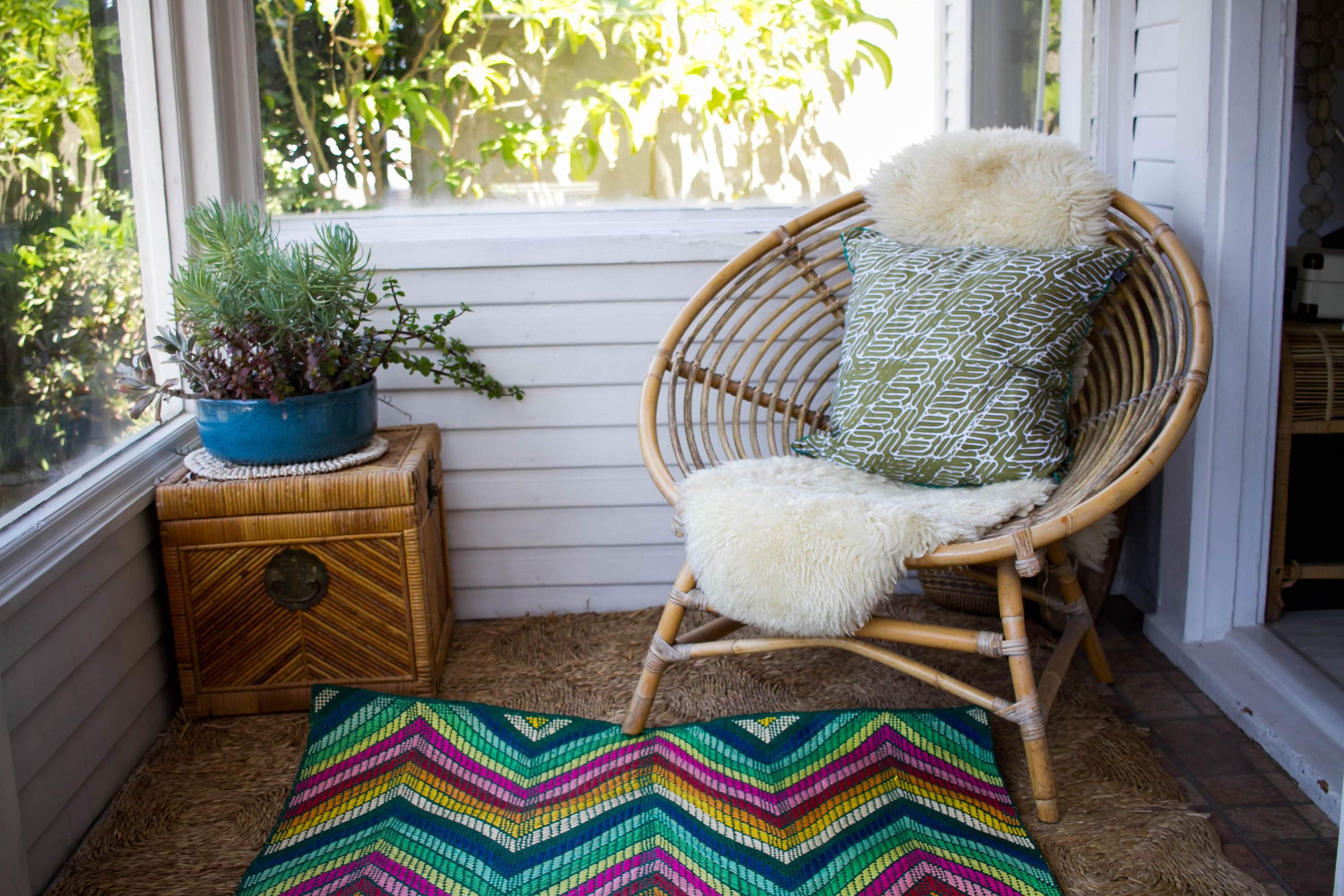 Olive green batik pillow with intricate traditional designs, handwoven and perfect for home decor.