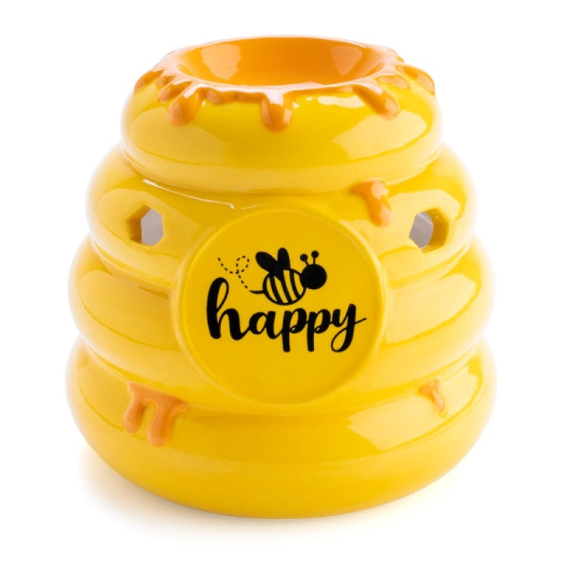 Bee Happy Oil Burner shaped like a beehive with golden honey drips and hexagonal cutouts, featuring a cheerful 'bee happy' design.