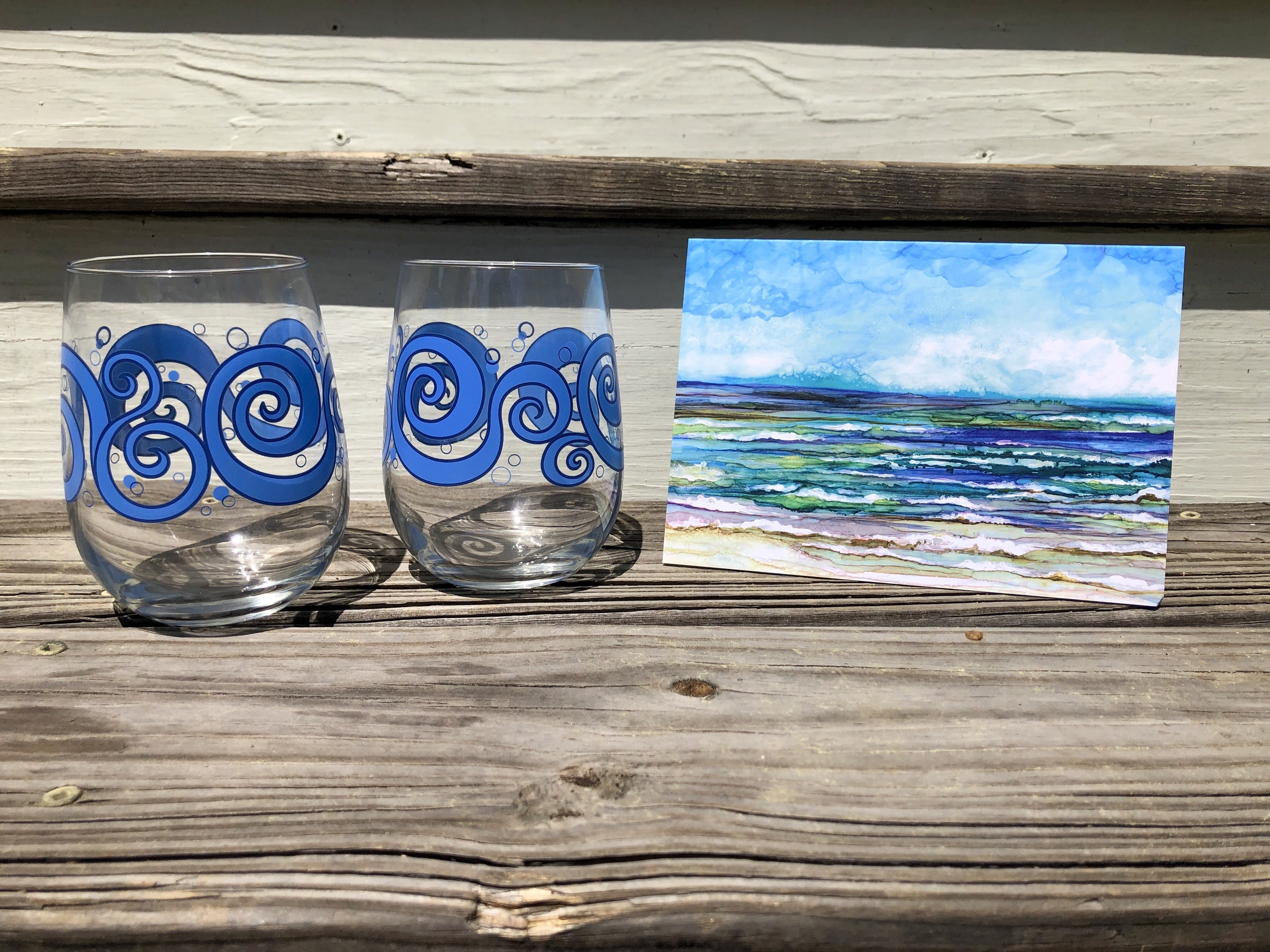 Beach Theme 3 Piece Gift Set featuring two ocean waves stemless wine glasses and an Ocean Breeze greeting card, beautifully arranged.