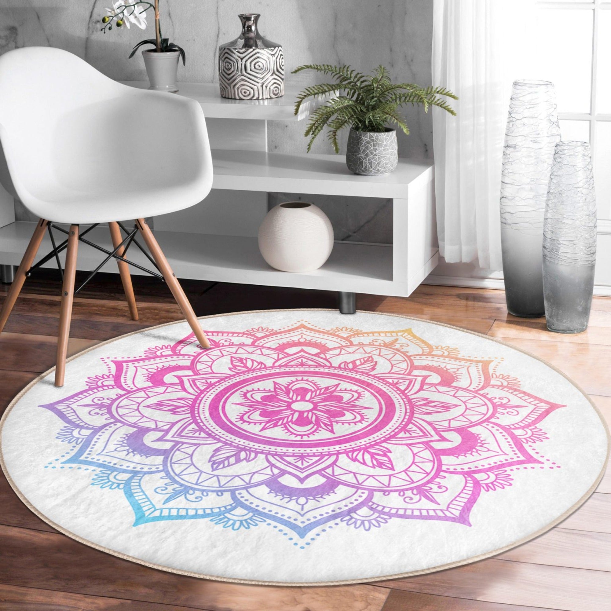 A beautifully designed round rug featuring a vibrant mandala pattern, perfect for cozy home decor and meditation spaces.