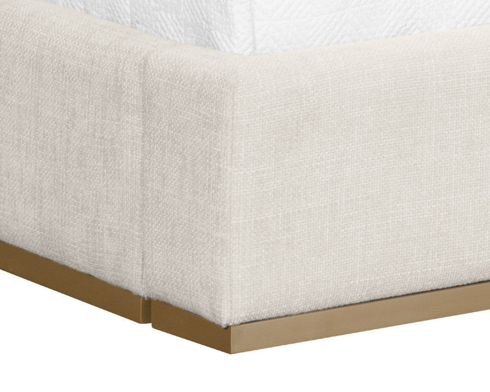 Beckham Bed in Chacha Cream with tufted headboard and antique brass base, showcasing modern design.