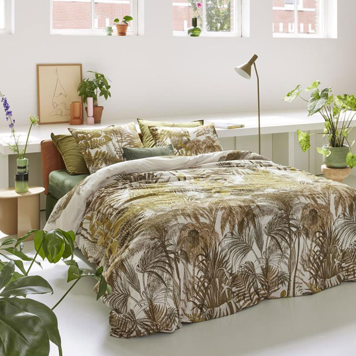 Bedding House Caribe Ochre Cotton Quilt Cover Set featuring tropical palm tree and fern designs in warm ochre and olive tones.