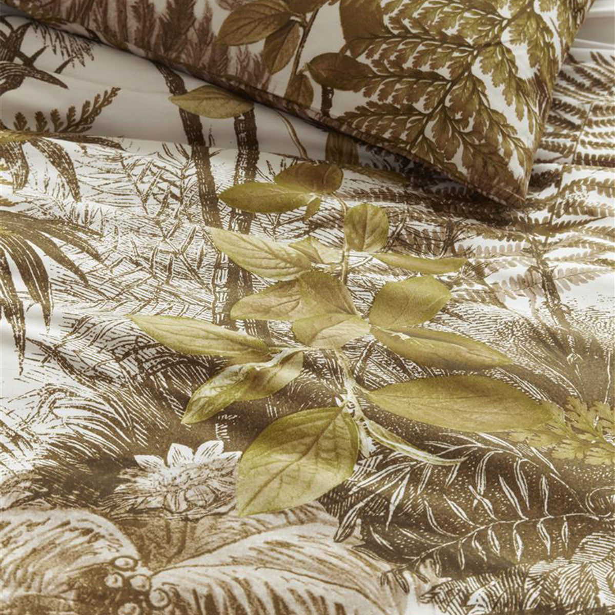 Bedding House Caribe Ochre Cotton Quilt Cover Set featuring tropical palm tree and fern designs in warm ochre and olive tones.