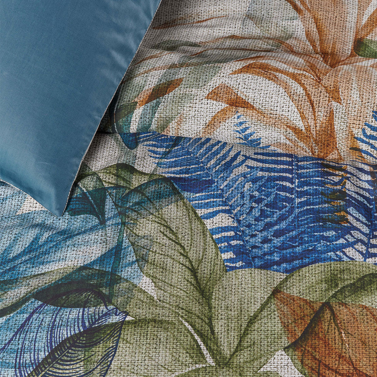 Isla Blue Cotton Sateen Quilt Cover Set featuring tropical foliage design in vibrant colors.