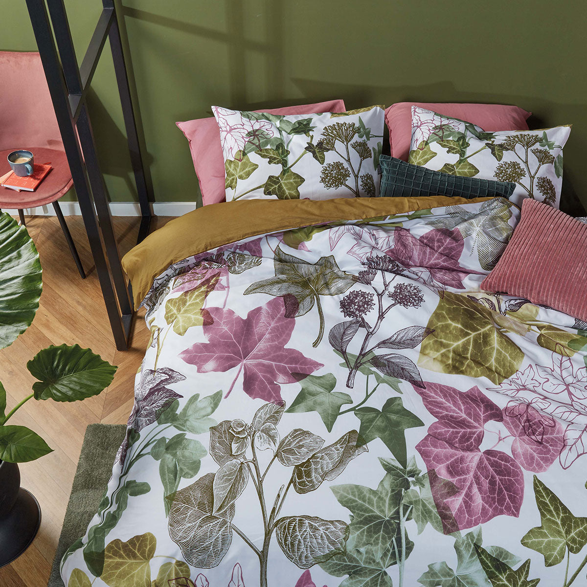 Ivy Multi Cotton Quilt Cover Set featuring vibrant ivy leaves on a light background with olive green reverse side.